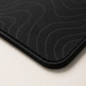 Close-up of the weave and stitched edge of the Contour Black Extended Mat