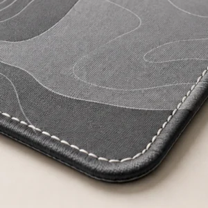 Close-up of the weave and stitched edge of the Contour Grey Stitched