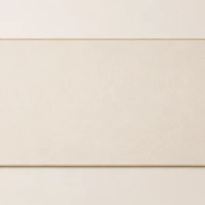 Ivory desk pad with faint grey contour lines and tan stitching