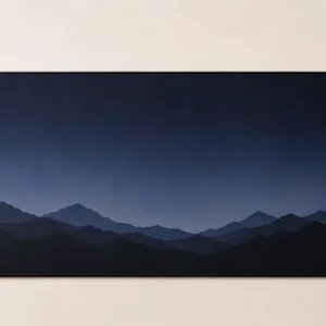 Extended desk mat with layered mountain ridge silhouettes at dusk