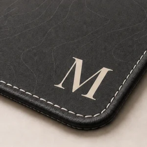 Close-up of the weave and stitched edge of the The Monogram Mat
